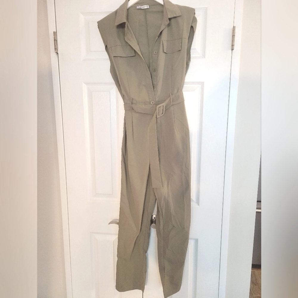 Green button-up jumpsuit with shoulder pads